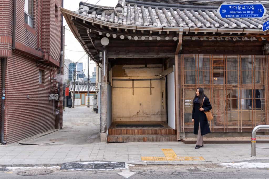 in front of theilma seoul flagship store in seoul hanok style house